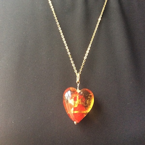 Red heart with gold swirls pendant necklace on gold plated chain is 24&quot; long