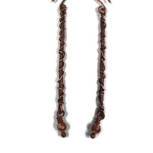 Long copper earrings with wire coils and twisted wire, dangling bead, hand formed, uniquely yours