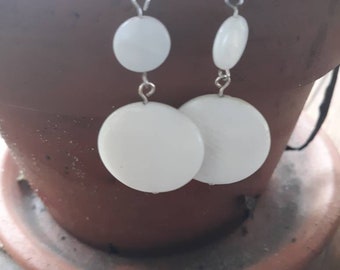 White pressed glass earrings with silver tone metal