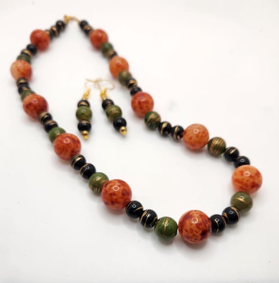 Upcycled vintage bead necklace or earrings, orange, green and black plastic beads, gold tone metal