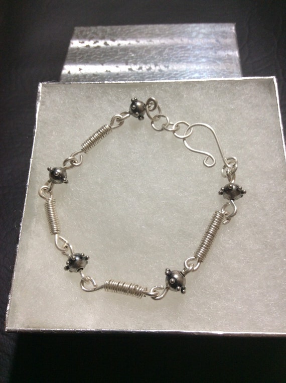 Sterling silver handmade chain bracelet with sterling silver coils and silver plated beads and handmade  closure, unisex bracelet