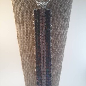 Peacock colored beaded bracelet with button and loop closure/lilac/crystal,glass.