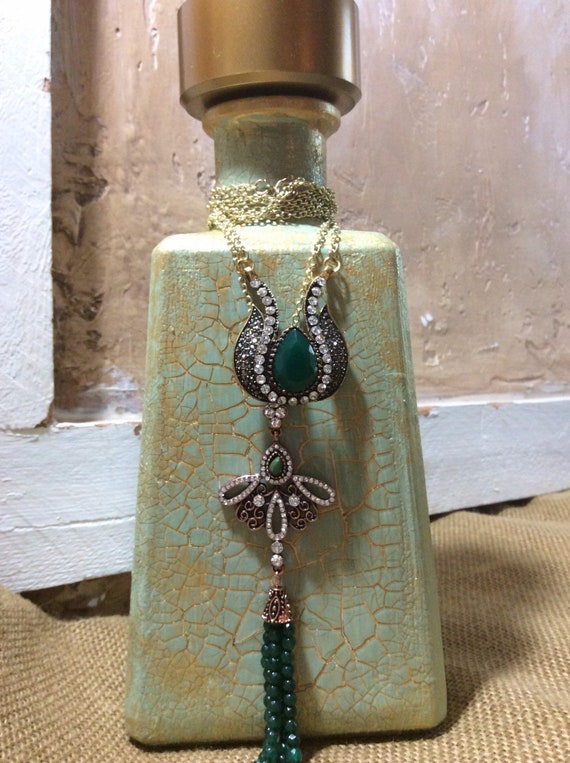Green and gold altered decorated tequila bottle, crackle finish, green, gold and rhinestone pendants, decorative bottle