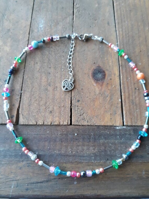 Colorful seed bead choker with extender chain measures 13" up to 15" and has a lobster claw clasp, boho gypsy style choker