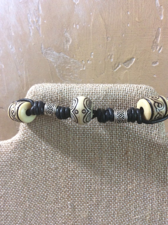 Black leather macrame bracelet for man or unisex, bone beads, silver tone beads and button