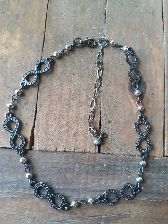 Infinity symbol choker in gun metal black