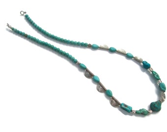 Southwestern necklace with turquoise color beads ,silver tone beads, toggle closure.