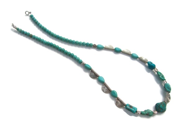 Southwestern necklace with turquoise color beads ,silver tone beads, toggle closure.