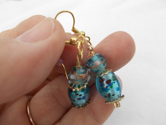 earrings with shimmering blue lamp work glass