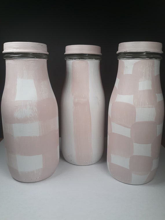 Danish pastel upcycled bottle, vase, or liquid storage in a rustic, minimalist style with freehand shapes in a casual style