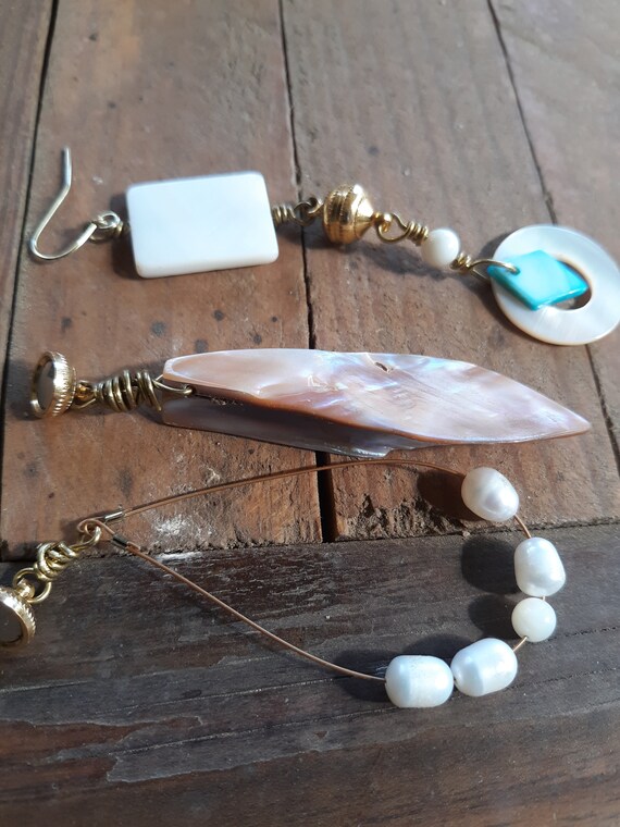 Three pairs of mermaid style earrings in pearl, mother of pearl and gold.  interchangeable earrings
