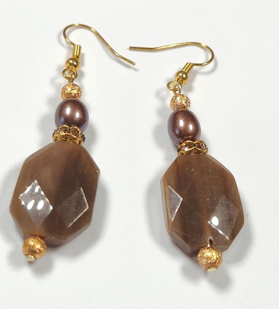 Brown and gold dangle earrings with glass beads, gold tone beads and rhinestone rondelles on gold tone ear wires, 2 1/4" long