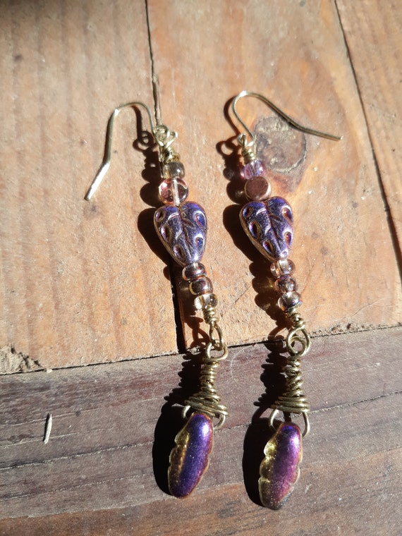 Iridescent purple and gold earrings with a purple heart