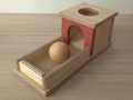 Montessori Object Permanence Box with Wooden Ball and Tray product logo