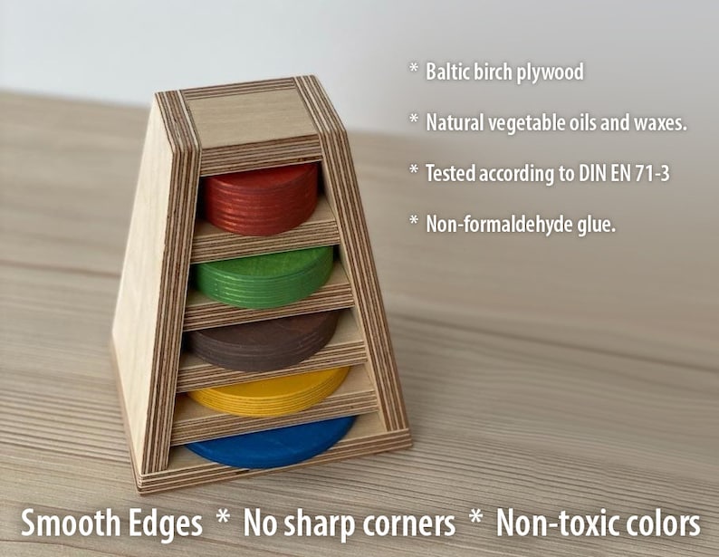 May include: A wooden stacking toy with five colorful rings. The toy is made of Baltic birch plywood and finished with natural vegetable oils and waxes. The toy is tested according to DIN EN 71-3 and is non-formaldehyde glue. The toy has smooth edges and no sharp corners. The colors are non-toxic.