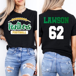 May include: Black t-shirt with green glitter text that says "Panthers Football" on the front and "LAWSON 62" on the back.