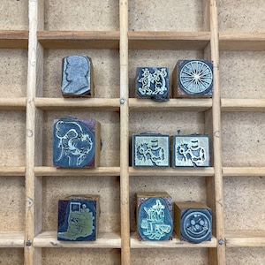 Vintage metal letterpress print type on wooden blocks, various designs.