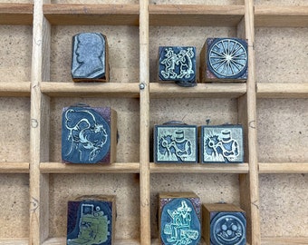 Vintage metal letterpress print type on wooden blocks, various designs.