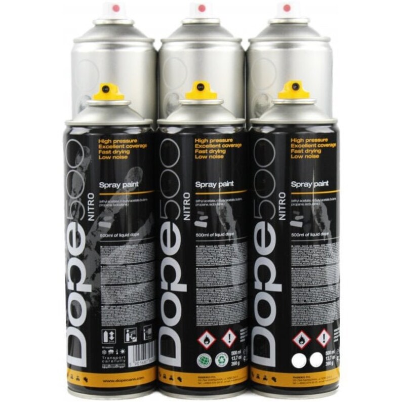 May include: Several spray paint cans are displayed. The cans are black with white and yellow details, and feature the text "Dope 500 NITRO Spray paint". The tops of the cans are silver with a red nozzle. The cans are labelled with "High pressure, Excellent coverage, Fast drying, Low noise".