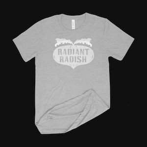 May include: A heather grey t-shirt with a white graphic of a stylized logo that says "Radiant Radish".