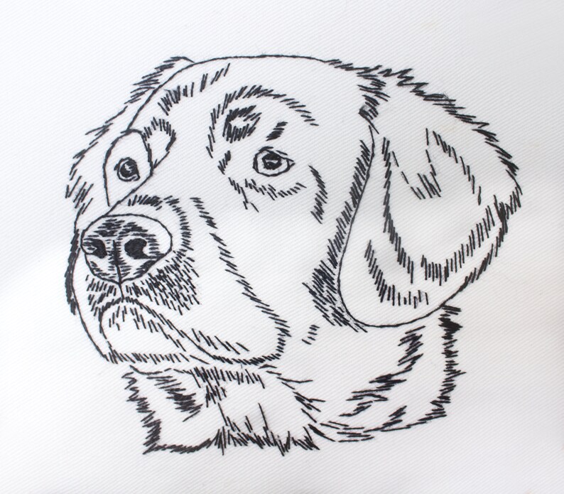 May include: A detailed black and white embroidered image of a dog's head. The dog's features, including the eyes, nose, and fur, are meticulously rendered with fine, textured lines on a white background. The artwork captures the dog's likeness.