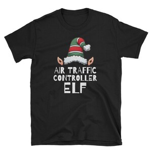 May include: Black t-shirt with a green and red elf hat and the text "Air Traffic Controller Elf".