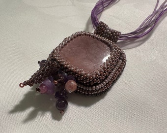 Handmade purple pendant with purple kunzite cabochon and amethyst beads.