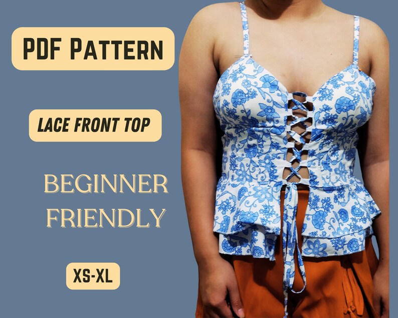May include: A PDF pattern for a lace front top. The pattern is beginner friendly and available in sizes XS-XL. The image shows a model wearing a white top with blue floral print and a lace-up front.