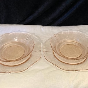 Two sets of pink MacBeth-Evans American Sweetheart salad plates and bowls