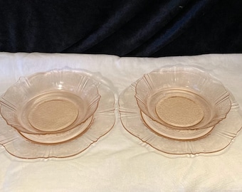 Two sets of pink MacBeth-Evans American Sweetheart salad plates and bowls