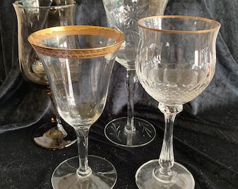 Set of four mismatched mid century  wine glasses, various styles; each lovely