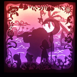 May include: A layered paper art piece depicting a tropical island scene with silhouettes of characters, palm trees, and a sailboat. The artwork features a gradient of pink, purple, and orange hues, creating a vibrant and dynamic composition. The piece is framed in a dark border.