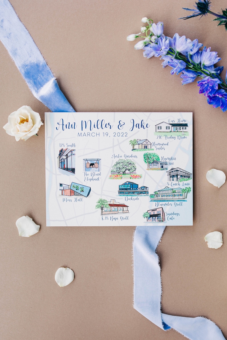 May include: A hand-drawn map of a wedding venue with the names of different locations, including "The Blunted Elephant", "Dockside", "K.B's Baja Grill", and "Sundays Cafe". The map is titled "Ann Miller & Jake" and the date "March 19, 2022".