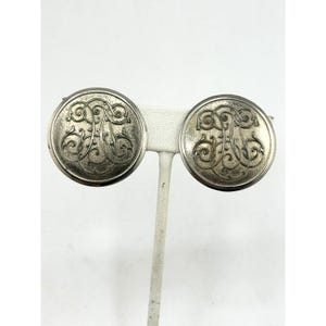 Orecchini a clip con monogramma vintage e design circolare