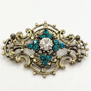 Vintage groene brochespeld met strassteentjes