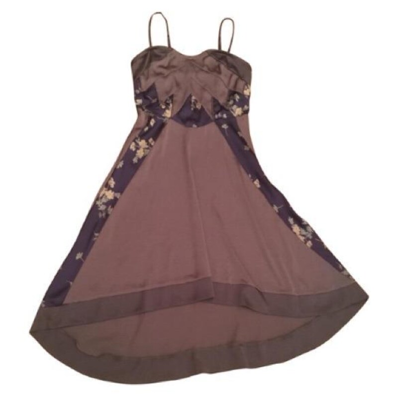 May include: A mauve-colored dress with thin straps and a flowing skirt. The dress features dark purple panels with floral patterns along the sides and bodice. The fabric has a satin-like sheen, giving it a luxurious appearance.