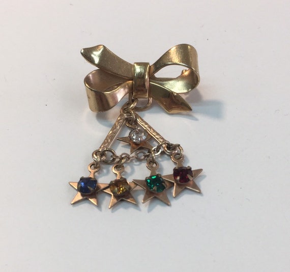 Hanging brooch best sale