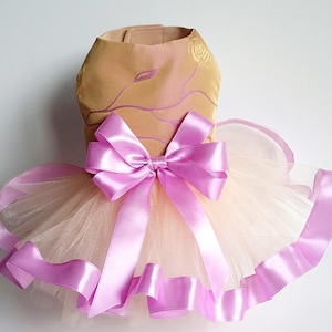 Gentle dress for small or big dog with lush skirt made of tulle, decorated pink ribbon and big bow, for wedding party, pet birthday.