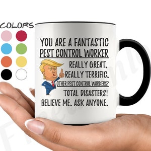May include: White ceramic coffee mug with a black handle. The mug has a black rim and features a cartoon image of a man with a thumbs up. The text on the mug reads "You are a fantastic pest control worker. Really great. Really terrific. Other pest control workers? Total disasters! Believe me. Ask anyone."