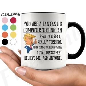 May include: White ceramic coffee mug with a black handle. The mug features a cartoon image of a man with a red tie and a black suit. The text on the mug reads "You are a fantastic computer technician. Really great. Really terrific. Other computer technicians? Total disasters! Believe me. Ask anyone."