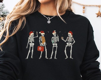 Sudadera de esqueleto de enfermera navideña, linda camiseta de fiesta de esqueleto de enfermera registrada, regalo de camisa de enfermera de urgencias de atención médica de vacaciones de Navidad