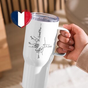 May include: White insulated tumbler with a handle, featuring a design of hands holding each other and the text "Grand-P&egrave;re". The names "Alex", "Hugo", "Sasha", and "Lucie" are also written on the tumbler.