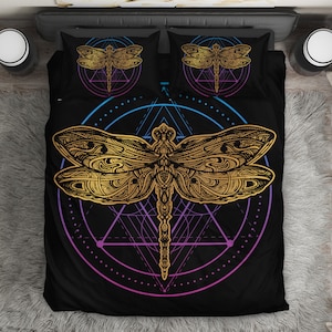 May include: A black duvet cover with a gold dragonfly design. The dragonfly is surrounded by a geometric pattern in shades of blue, purple, and pink.