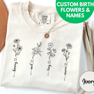 Oma familie geboorte bloemen comfort kleuren shirt, gepersonaliseerde gigi aangepaste verjaardagscadeau van kleinkinderen, oma&#39;s kleinkinderen namen T-shirt