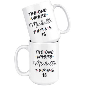 May include: Two white coffee mugs stacked on top of each other. The mug on top has the text "THE ONE WHERE Michelle TURNS 18" in black with colorful dots. The mug on the bottom has the same text.