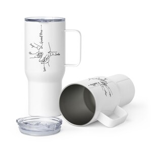 May include: White travel mug with a handle and a lid. The mug features a black line drawing of hands holding each other, with the names "Hugo", "Alex", "Lucie", and "Sacha" written on it. The word "Grand-Pere" is also written on the mug.
