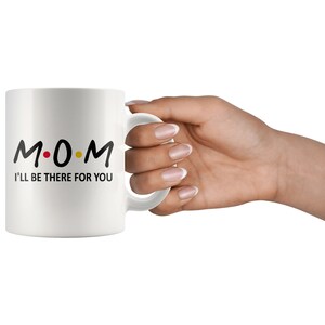 May include: White ceramic mug with a black and yellow design that says "M.O.M. I'll be there for you".