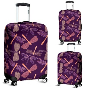 May include: Purple luggage cover with a pink dragonfly pattern. The cover is designed to fit a standard sized suitcase.