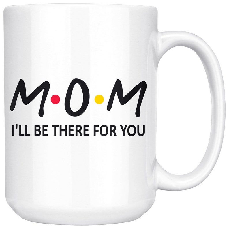 May include: White ceramic coffee mug with a black and yellow design that says "M.O.M. I'll be there for you".