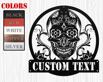May include: Black metal wall art featuring a sugar skull with floral designs and the text "CUSTOM TEXT".